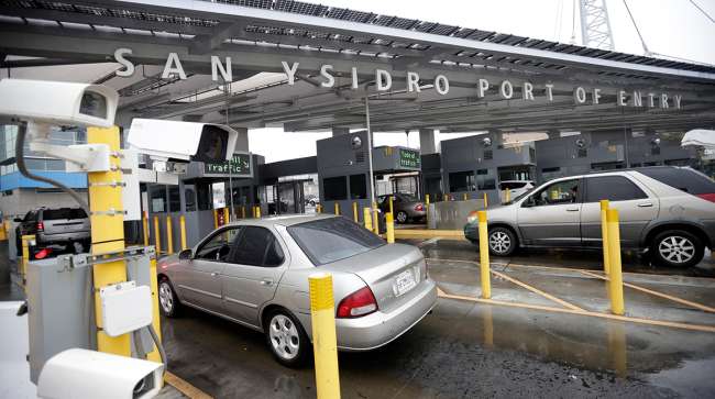 Cars wait to enter the United States from Tijuana, Mexico through the San Ysidro port of entry in San Diego.