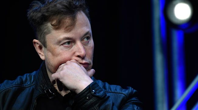 Tesla CEO Elon Musk listens to a question at a conference in Washington on March 9.