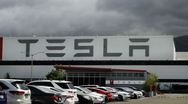 Tesla's plant in Fremont, Calif., is seen from the parking lot on May 12.